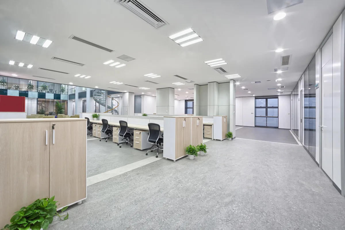 Open-plan office with white workstations